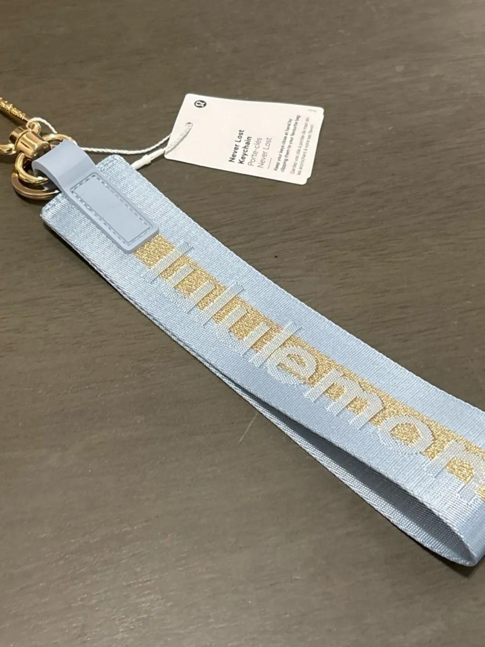 lululemon athletica light blue keychain wristlet with gold stripe